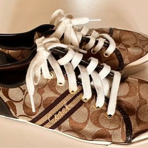 Coach brown leather with brown, tan & white logo fabric. White laces & soles.